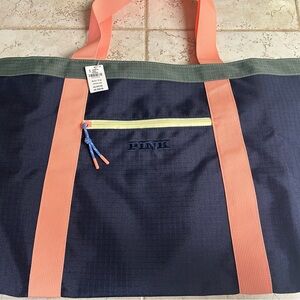 Pink Victoria’s Secret tote bag and beach towel